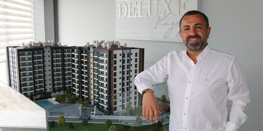 Harun Göçeri, Chairman of Hay Yapı, beside the model of the Deluxe Kuzey project